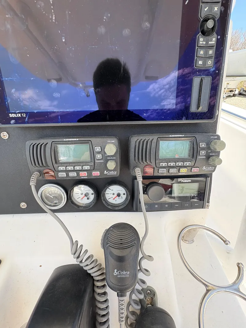 Slide: The Image of Control panel of a 2013 Tidewater 230 boat with navigation and communication equipment. - 20