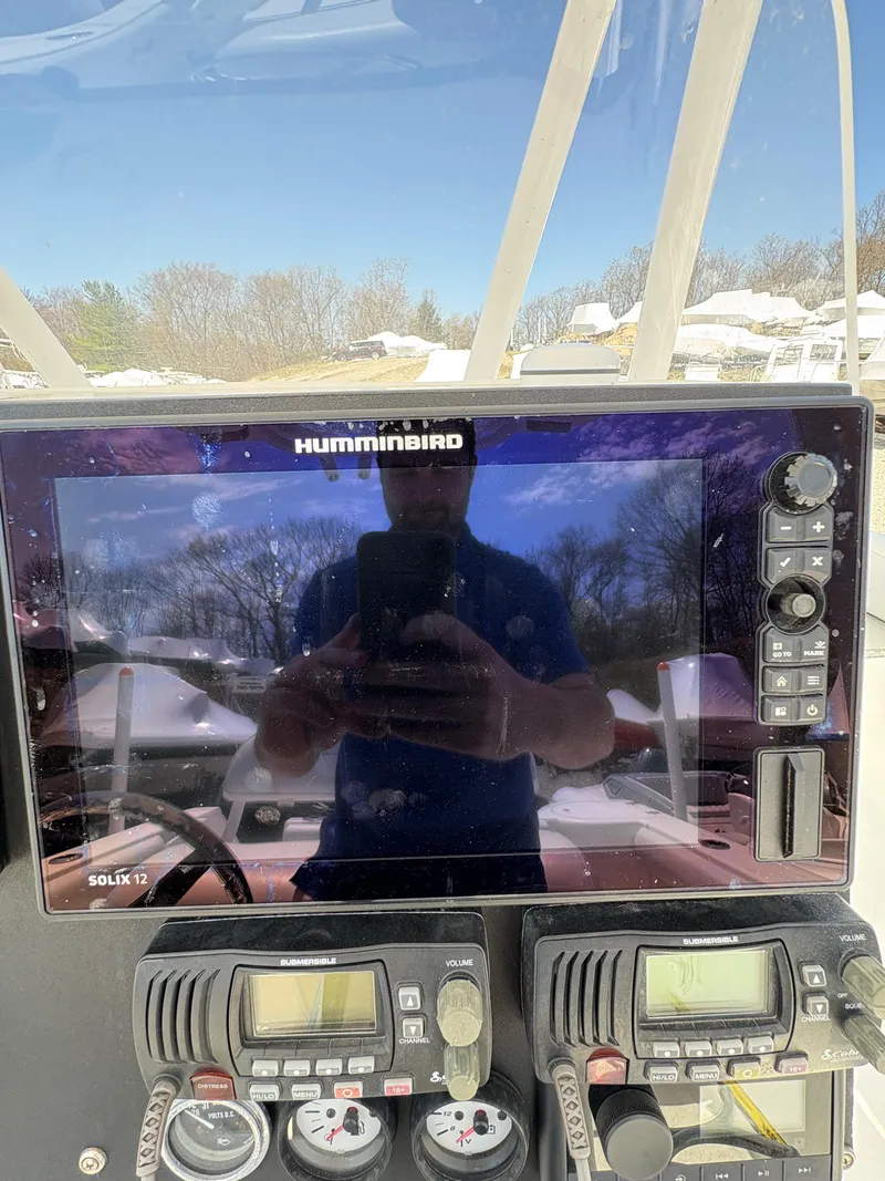 Slide: The Image of Tidewater 230 boat dashboard with Humminbird electronics, 2013 model. - 21