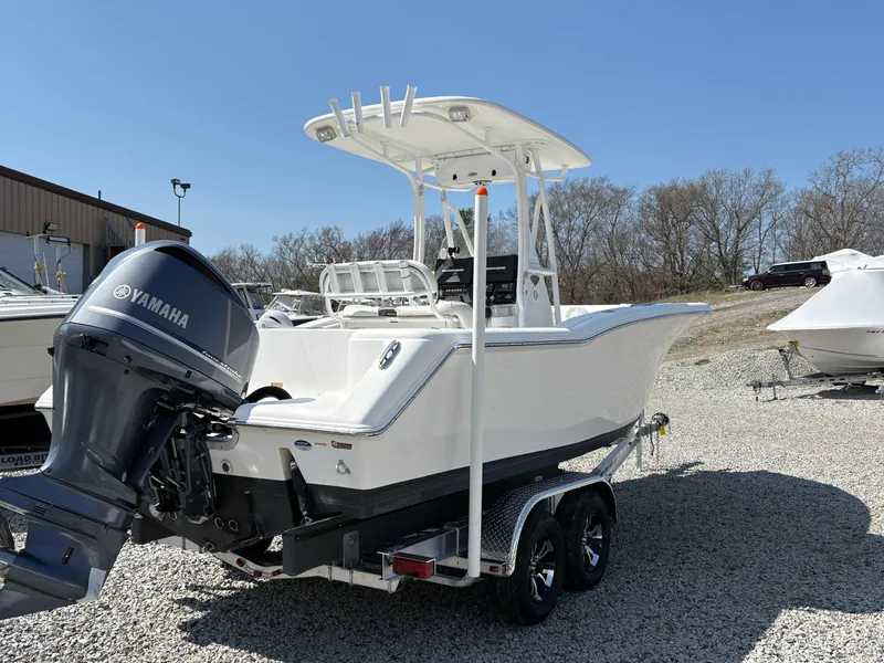 Slide: The Image of 2013 Tidewater 230 boat with Yamaha engine on trailer, parked outdoors. - 7