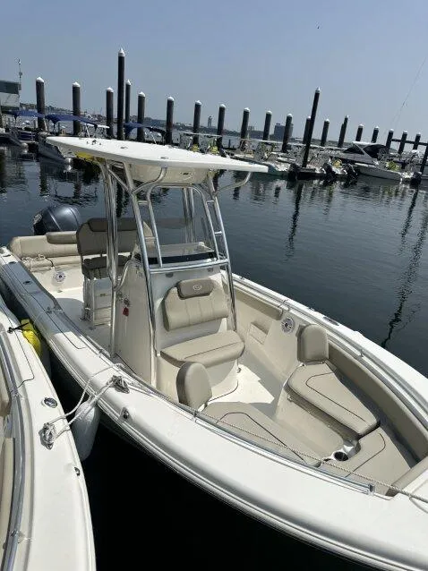 Slide: The Image of 2022 Key West 239 FS boat docked at marina, calm water, clear sky. - 3