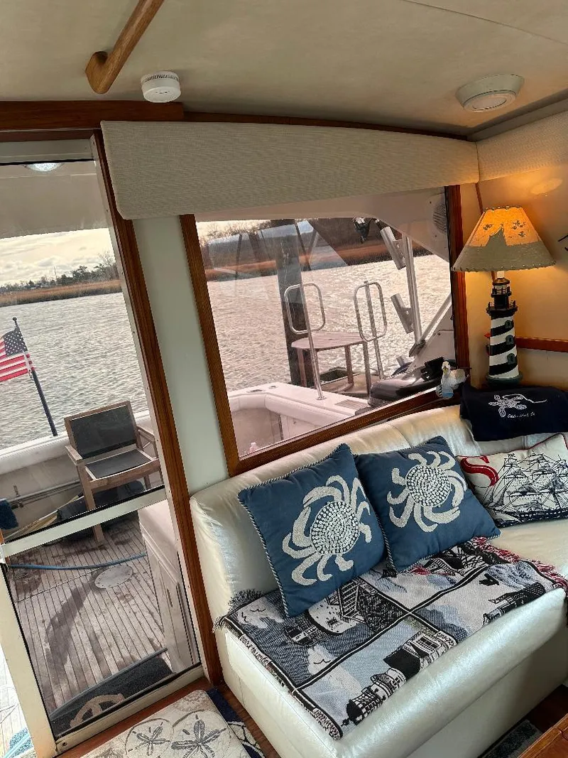 Slide: The Image of Interior of a 1989 Bertram 43 Convertible yacht with nautical-themed decor. - 14