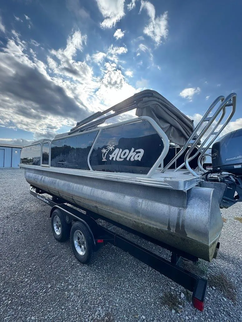 Slide: The Image of Dashboard of a 2021 Aloha Pontoon Tropical Series boat with gauges and controls. - 3
