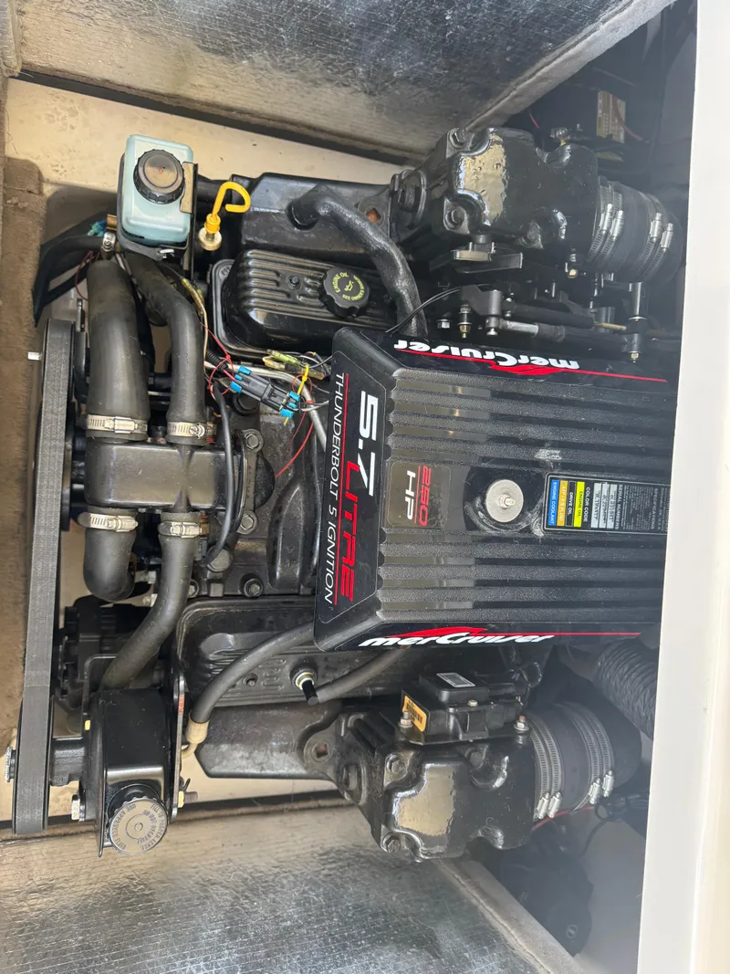 Slide: The Image of Engine of 1998 Mariah 222 Shabah boat, featuring a 5.7L V8 MerCruiser. - 11