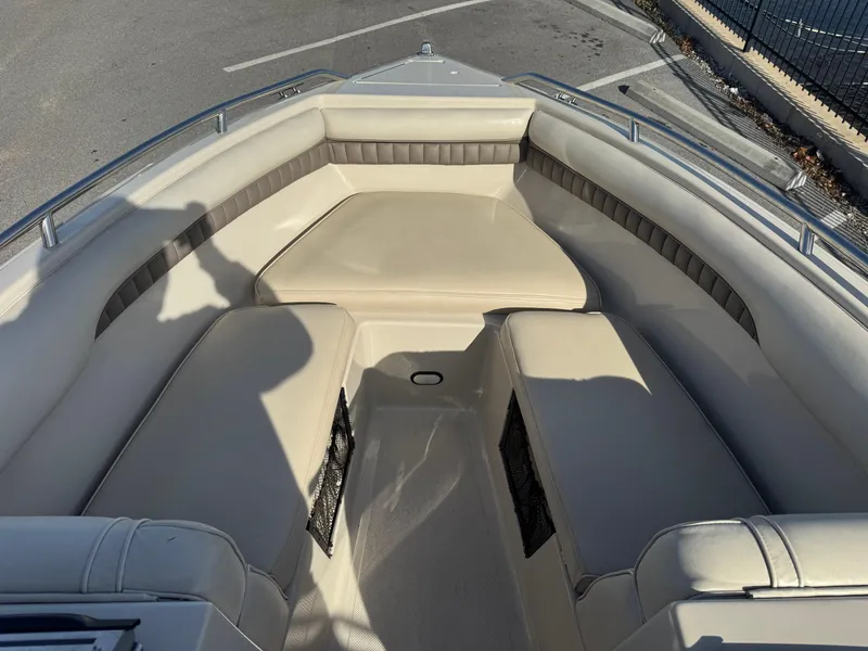 Slide: The Image of Interior of a 1998 Mariah 222 Shabah boat with beige seating. - 12