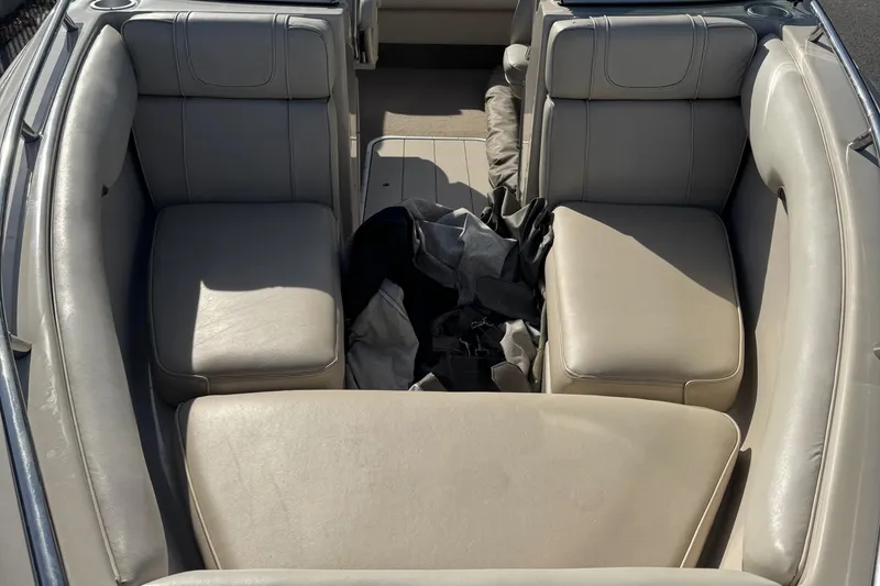 Slide: The Image of Interior of a 1998 Mariah 222 Shabah boat with beige leather seats. - 13