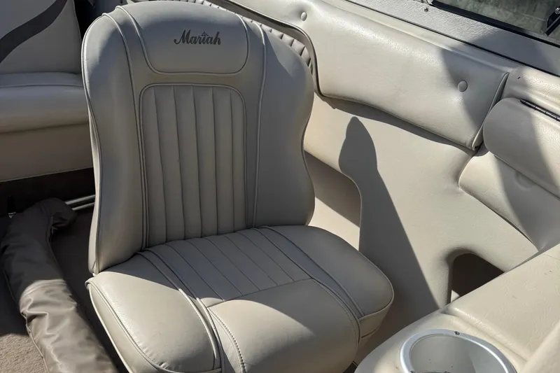 Slide: The Image of 1998 Mariah 222 Shabah boat interior with beige leather seating. - 15