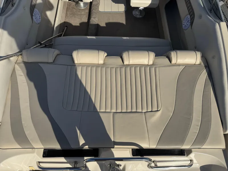 Slide: The Image of Interior seating of 1998 Mariah 222 Shabah boat with beige upholstery. - 6