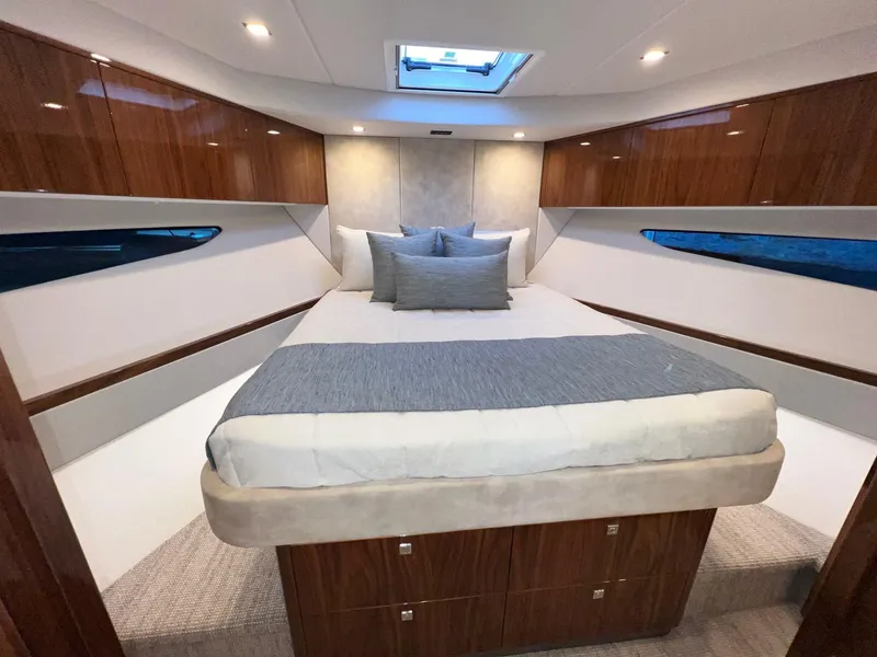 Slide: The Image of Luxurious bedroom interior of 2023 Riviera 4600 Sport Yacht Platinum Edition. - 15