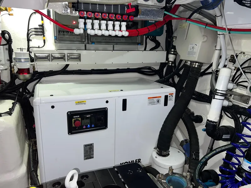 Slide: The Image of Engine room of 2023 Riviera 4600 Sport Yacht Platinum Edition with Kohler generator. - 22