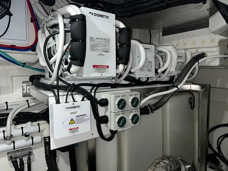 Slide: The Image of Engine room of 2023 Riviera 4600 Sport Yacht with Dometic equipment. - 25