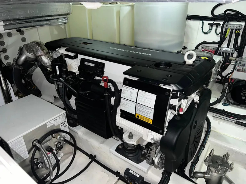 Slide: The Image of Engine room of 2023 Riviera 4600 Sport Yacht Platinum Edition, showcasing advanced machinery and components. - 26