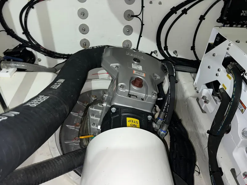 Slide: The Image of Engine compartment of 2023 Riviera 4600 Sport Yacht Platinum Edition with visible mechanical components. - 27