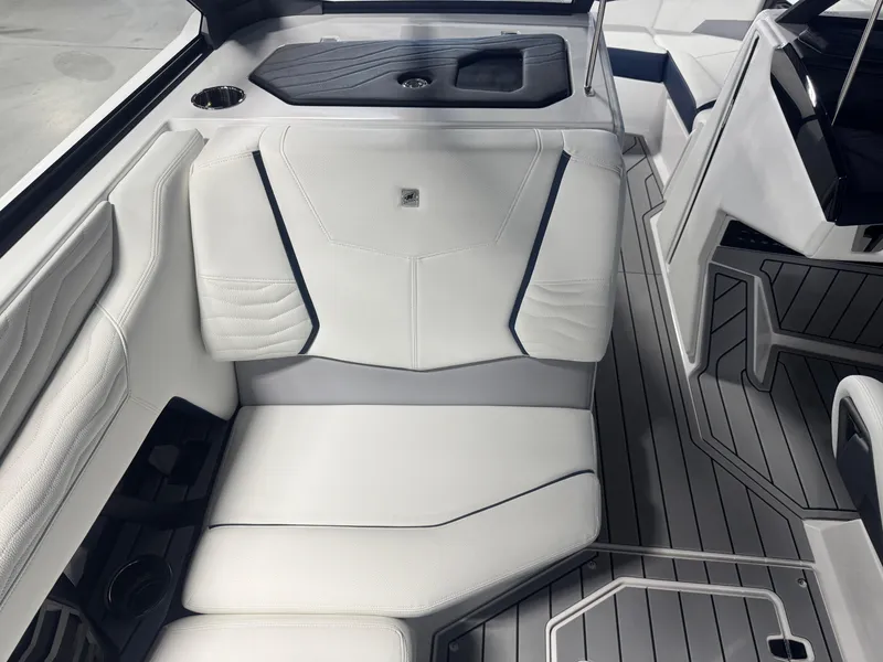 Slide: The Image of 2025 Nautique Super Air Nautique G23 interior with white seating and sleek design. - 10