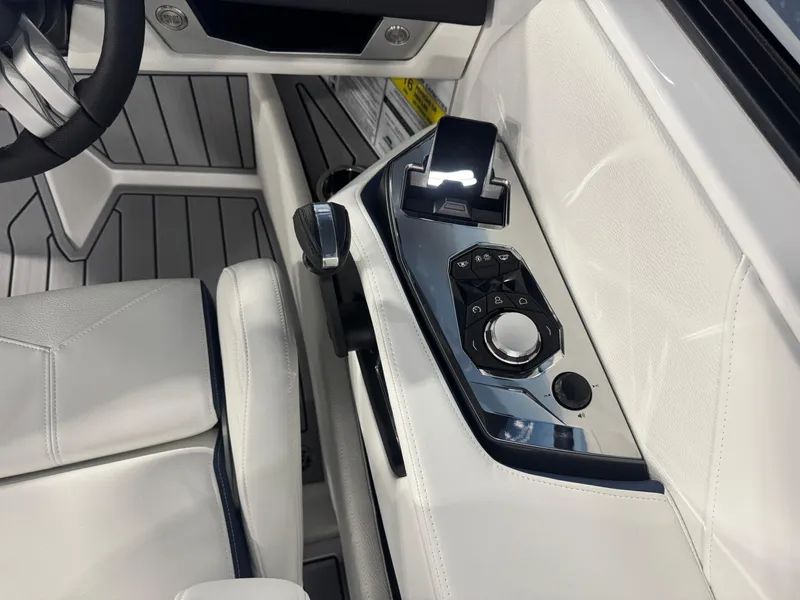 Slide: The Image of 2025 Nautique Super Air Nautique G23 interior control panel with sleek design and modern features. - 12