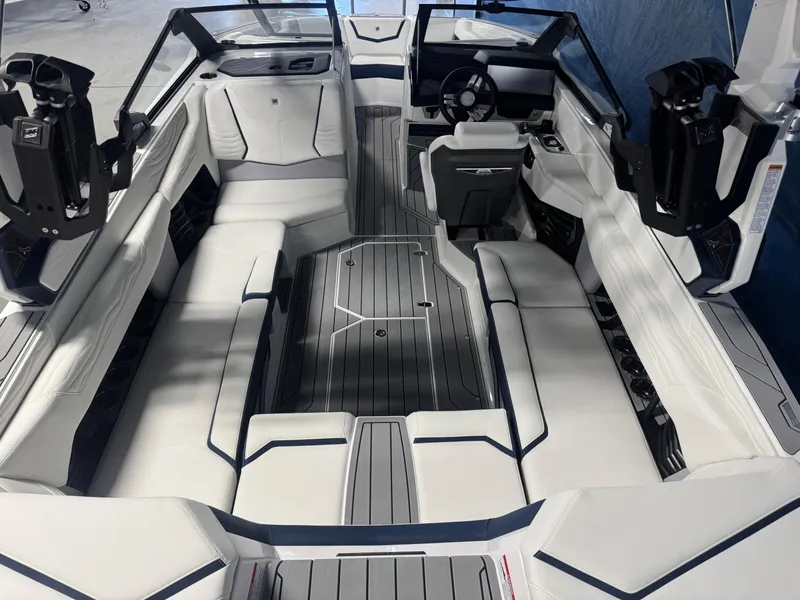 Slide: The Image of 2025 Nautique Super Air Nautique G23 interior with sleek seating and modern design. - 5