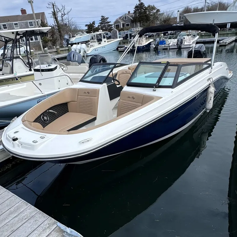 The Image of 2023 Sea Ray SPX 230 Outboard boat docked in harbor. - 0