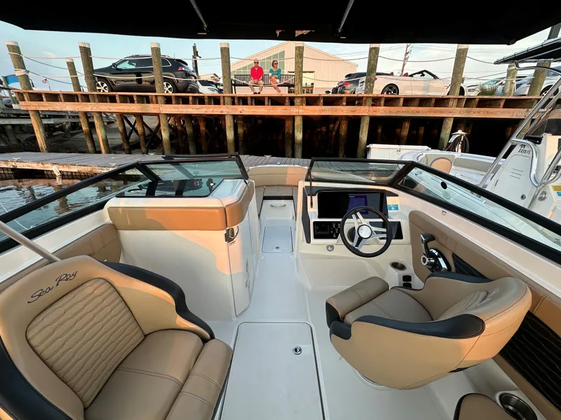 Slide: The Image of Interior of a 2023 Sea Ray SPX 230 Outboard boat at the dock. - 2