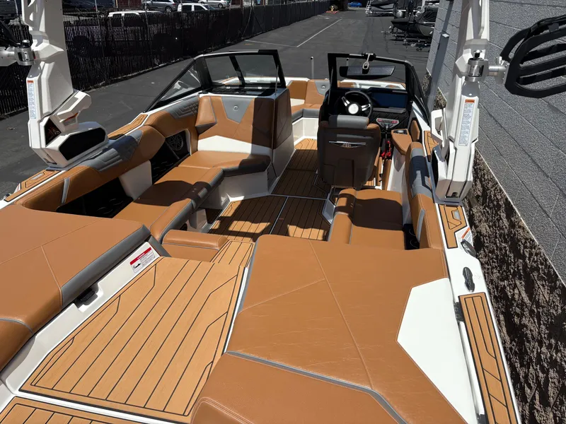 Slide: The Image of 2025 Nautique Super Air Nautique S21 boat interior with tan seating and modern design. - 3