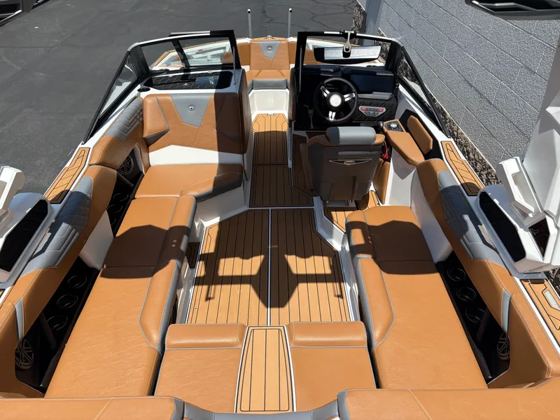 Slide: The Image of 2025 Nautique Super Air Nautique S21 interior with tan seating and sleek design. - 4