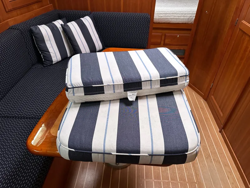 Slide: The Image of Interior of 2006 Sabre 42 Hard Top Express with striped cushions and wooden table. - 18