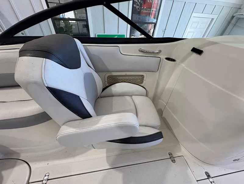 Slide: The Image of 2017 SouthWind 2400 SD boat interior with white and gray seating. - 10