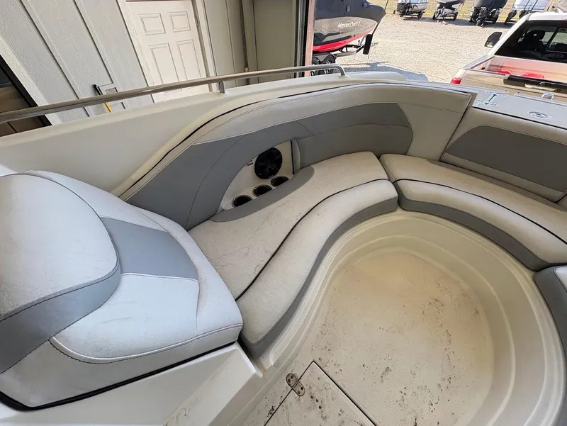 Slide: The Image of 2017 SouthWind 2400 SD boat interior with cushioned seating and storage compartments. - 18
