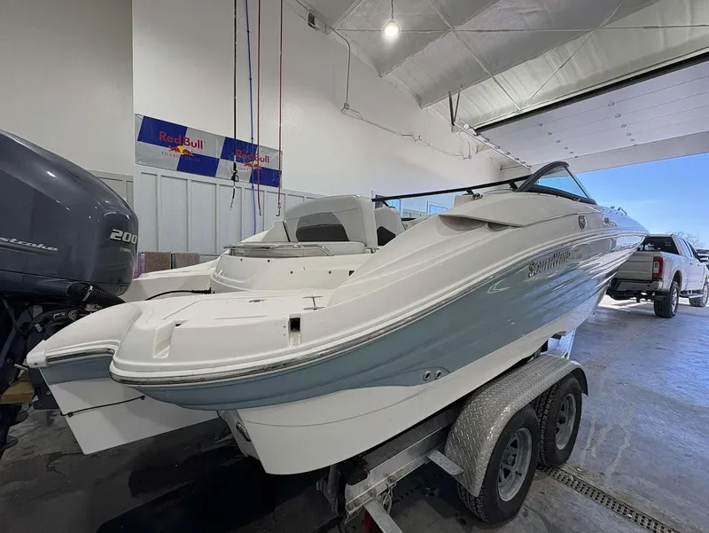 Slide: The Image of 2017 SouthWind 2400 SD boat on trailer in a garage setting. - 3