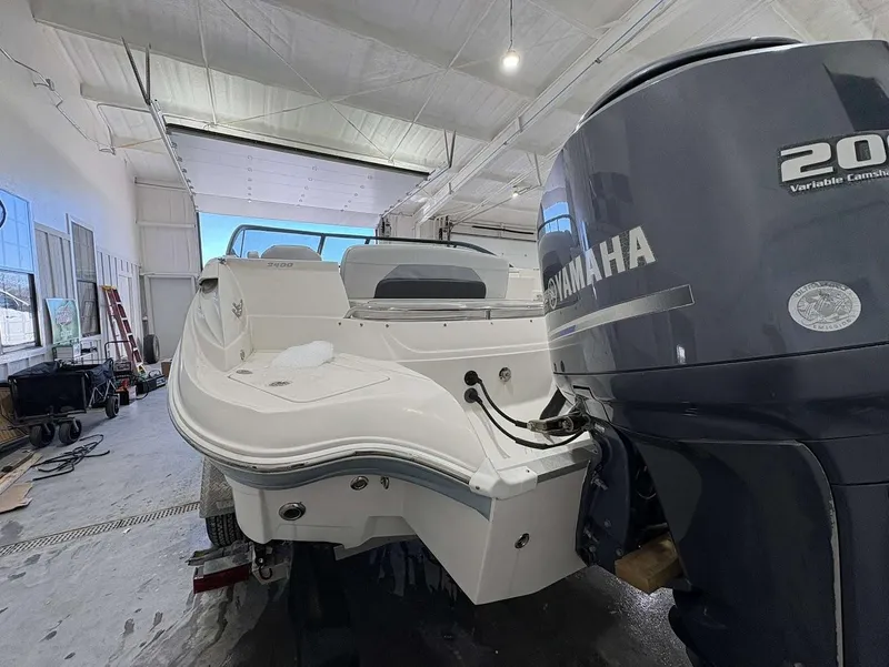 Slide: The Image of 2017 SouthWind 2400 SD boat with Yamaha 200 engine in a garage setting. - 4