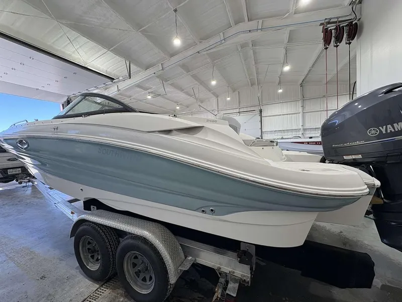 Slide: The Image of 2017 SouthWind 2400 SD boat on trailer in indoor storage facility. - 6