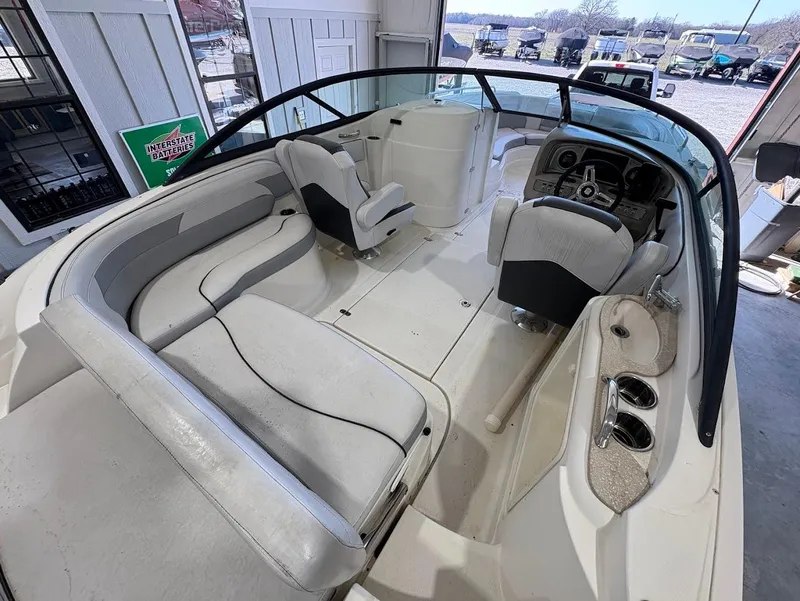 Slide: The Image of 2017 SouthWind 2400 SD boat interior with spacious seating and modern dashboard. - 9