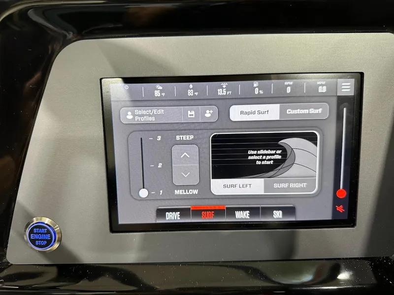 Slide: The Image of Touchscreen control panel of a 2025 MasterCraft NXT23 boat, featuring surf and wake settings. - 14