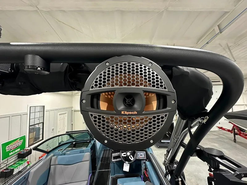 Slide: The Image of 2025 MasterCraft NXT23 boat with Klipsch speaker system, interior view. - 16