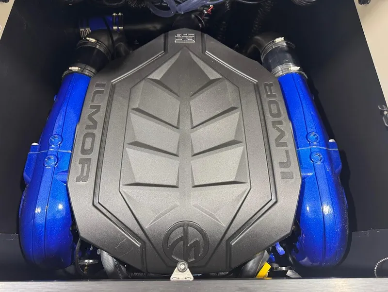 Slide: The Image of 2025 MasterCraft XT22 T boat on trailer in showroom, Dallas Boathouse. - 15