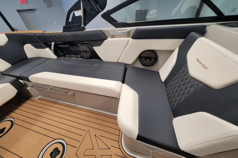 Slide: The Image of 2025 MasterCraft XT22 T boat interior with luxurious seating and modern design. - 29