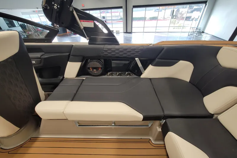 Slide: The Image of 2025 MasterCraft XT22 T boat interior with luxurious seating and modern design. - 31