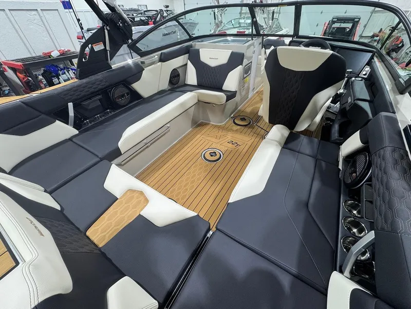 Slide: The Image of Rear view of 2025 MasterCraft XT22 T boat showing propeller and underwater lights. - 9