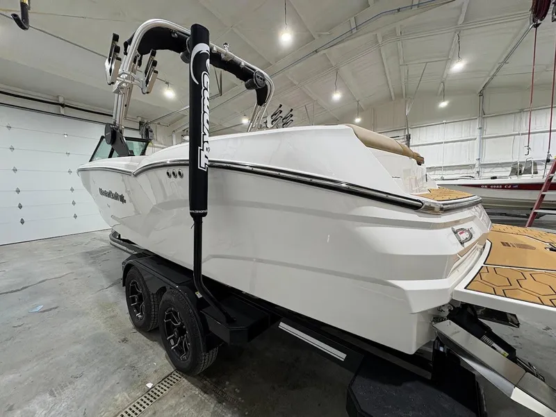 Slide: The Image of 2025 MasterCraft NXT24 boat in a garage, featuring sleek design and modern features. - 5