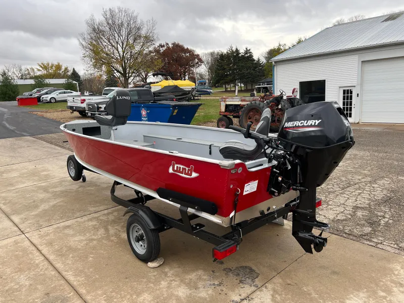 Slide: The Image of 2025 Lund 1600 Fury Tiller boat with Mercury engine on a trailer. - 5