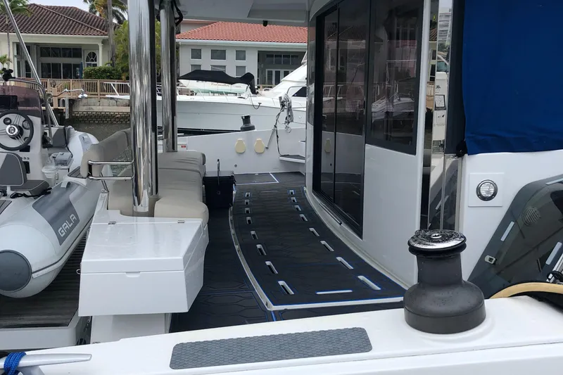 Slide: The Image of Bali 5.4 yacht deck, 2021 model, featuring modern seating and sleek design. - 15