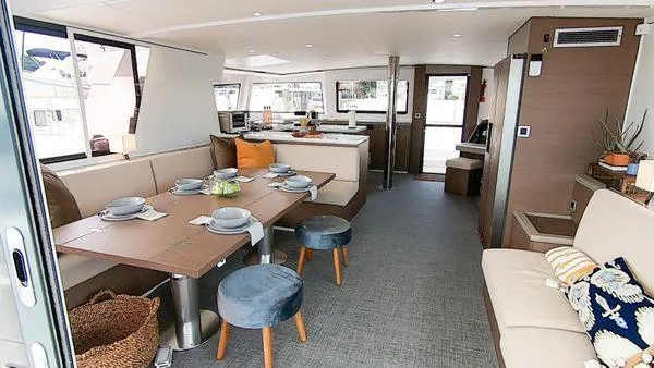 Slide: The Image of Luxurious interior of 2021 Bali 5.4 catamaran with elegant dining area and modern decor. - 19