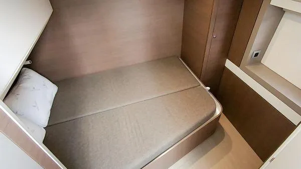 Slide: The Image of Compact cabin bedroom in a 2021 Bali 5.4 yacht, featuring a cozy bed and modern design. - 23