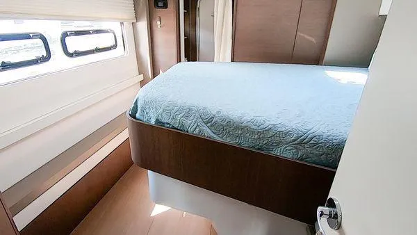 Slide: The Image of Cozy bedroom in 2021 Bali 5.4 yacht with blue bedding and modern design. - 26