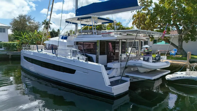 Slide: The Image of 2021 Bali 5.4 catamaran docked, featuring spacious deck and modern design. - 41