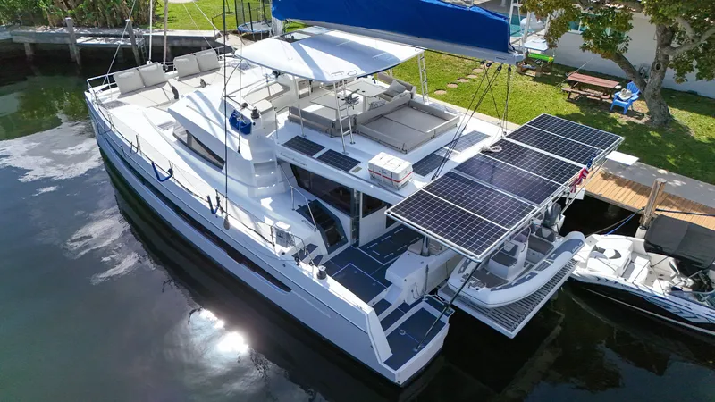 Slide: The Image of Luxury Bali 5.4 catamaran with solar panels docked, 2021 model. - 42
