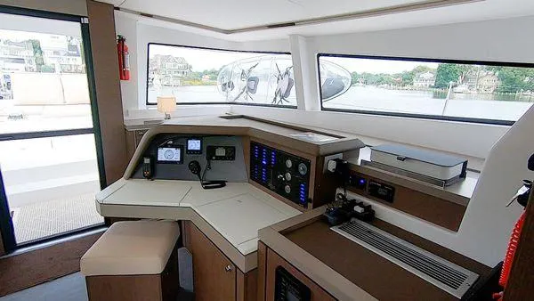Slide: The Image of Modern helm station of 2021 Bali 5.4 catamaran with navigation equipment and panoramic windows. - 9