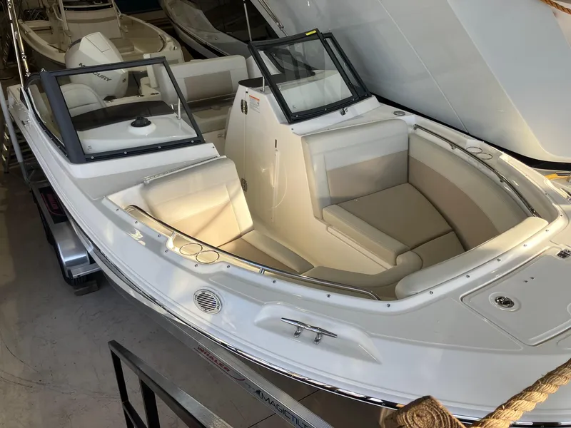 Slide: The Image of 2025 Boston Whaler 210 Vantage boat with sleek design and spacious seating. - 2