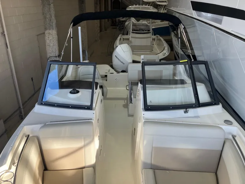 Slide: The Image of 2025 Boston Whaler 210 Vantage boat interior with dual consoles and seating. - 3