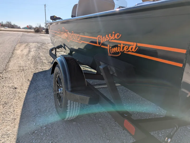 Slide: The Image of 2025 Tracker Bass Tracker Classic Limited boat on a trailer, side view. - 42