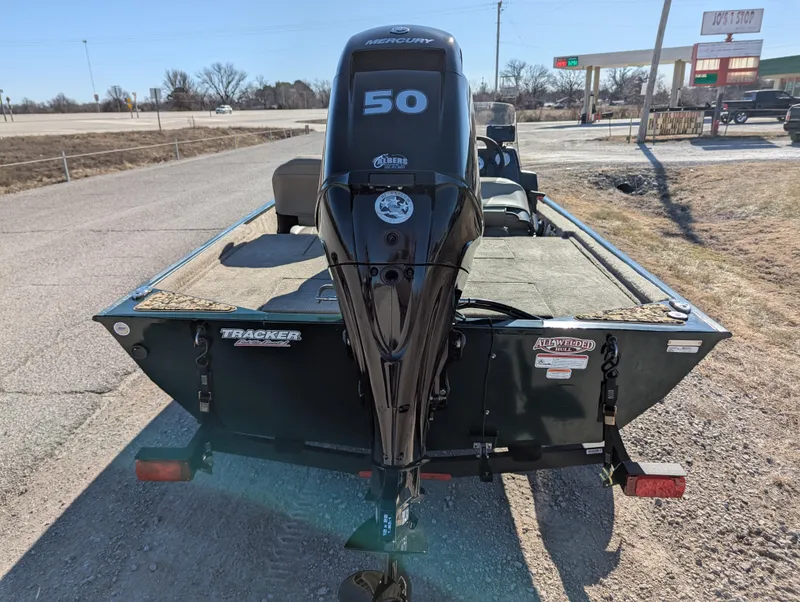 Slide: The Image of 2025 Tracker Bass Tracker Classic Limited boat with 50 HP motor on a trailer. - 43