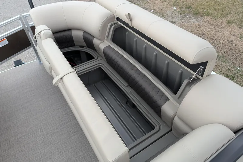 Slide: The Image of 2025 Sun Tracker SportFish 20 DLX boat seating with storage compartment open. - 102